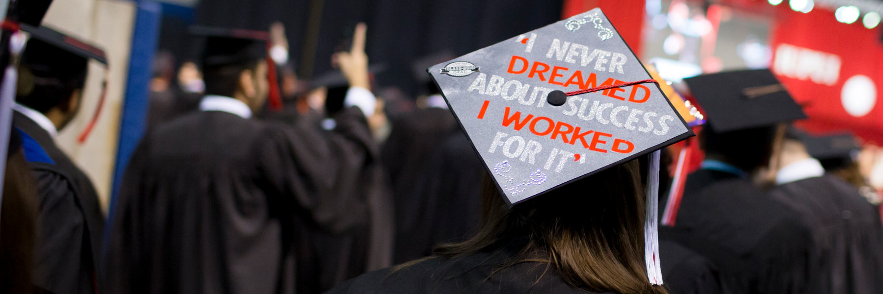A graduate's mortar board reads 'I never dreamed about success I worked for it'.
